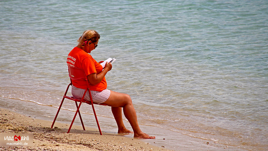 Lady while reading on the Côte d'Azur